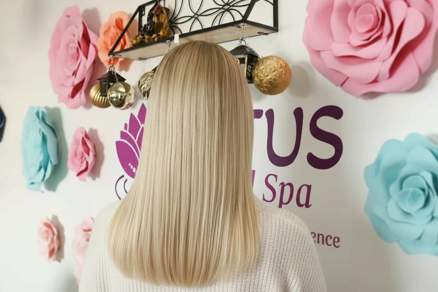 Silk press on natural hair showing silky smooth, glossy results