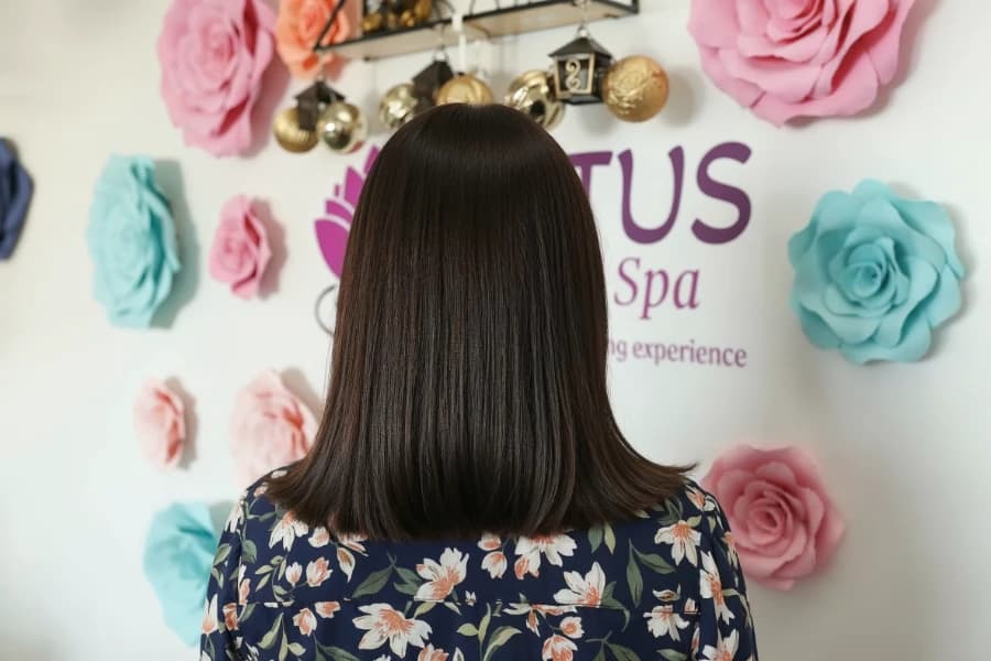 Professional women's haircut with precision styling and blow-dry finish