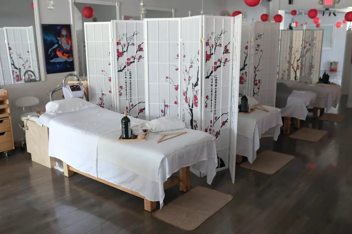 Lotus Head Spa reception area with comfortable seating and complimentary beverages